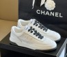 Женские кожаные кроссовки Chanel 2024 белые с черными шнурками