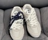 Женские замшевые кроссовки Miu Miu х New Balance 2024 светло-серые с разноцветными шнурками