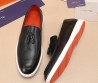 Мужские кожаные лоферы Santoni 2024 черные гладкие с кисточками