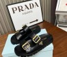 Женские кожаные шлепки Prada черные с золотыми пряжками 2024