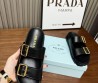 Женские кожаные шлепки Prada черные с золотыми пряжками 2024