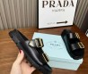 Женские кожаные шлепки Prada черные с золотыми пряжками 2024