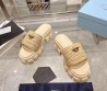 Женские плетёные шлепанцы Prada Monolith бежевые на тракторной подошве 2024
