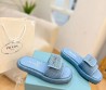 Женские шлепки Prada голубые с эффектом рафии 2024