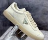 Женские кожаные кроссовки Prada белые с логотипом 2024