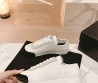 Женские кожаные кроссовки Chanel белые с черным носом 2024