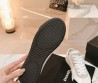 Женские кожаные кроссовки Chanel белые с черным носом 2024