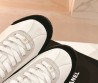Женские кожаные кроссовки Chanel белые с черным носом 2024