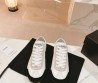 Женские кожаные кроссовки Chanel белые с черным носом 2024