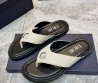 Мужские кожаные шлепанцы Christian Dior молочные с черной подошвой с серебристым украшением 2024