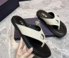 Мужские кожаные шлепанцы Christian Dior молочные с черной подошвой с серебристым украшением 2024