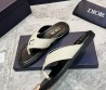 Мужские кожаные шлепанцы Christian Dior молочные с черной подошвой с серебристым украшением 2024