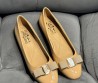 Женские кожаные балетки Salvatore Ferragamo Varina ballet flat бежевые лакированные 2024