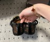 Женские плетеные туфли Alaia Jewel черные с золотой пряжкой 2024
