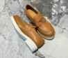 Женские кожаные лоферы Prada коричневые с логотипом на толстой подошве 2024
