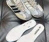 Женские комбинированные кроссовки Adidas серые с полосками 2024