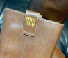 Женские кожаные сапоги Miu Miu Fume коричневые 2024