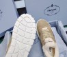 Женские замшевые кроссовки Prada бежевые c мехом 2024
