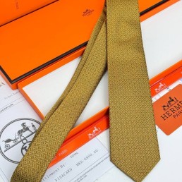 Мужской шелковый галстук Hermes желто-коричневый с узором 150 см 2024