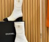 Женские комбинированные сапоги Chanel белые с черным 2025
