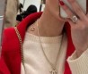 Женское колье Chanel золотистое с логотипом 2025