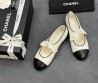 Женские кожаные балетки Chanel белые с черным носом с бантом 2025