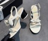 Женские кожаные босоножки Chanel белые с бантиком 2025