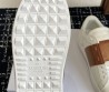 Женские кожаные кроссовки Valentino Rockstud Untitled белые с коричневым 2025