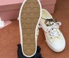 Женские текстильные кеды Miu Miu светло-желтые с разноцветными шнурками 2025
