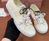 Женские текстильные кеды Miu Miu светло-желтые с разноцветными шнурками 2025
