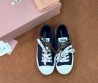 Женские текстильные кеды Miu Miu синие с разноцветными шнурками 2025