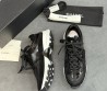 Женские комбинированные кроссовки Chanel черные глянцевые 2025