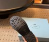 Женские кожаные укороченные сапоги Prada коричневые 2025