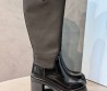 Женские кожаные сапоги Prada черные на каблуке 2025