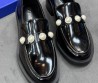 Женские кожаные лоферы Stuart Weitzman черные лакированные с жемчужинами 2025