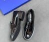 Женские кожаные лоферы Stuart Weitzman черные лакированные 2025