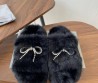 Женские меховые шлепанцы Balenciaga черные с бантом из страз 2025