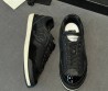 Женские кожаные кроссовки Chanel черные с лакированным носом 2025