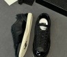 Женские кожаные кроссовки Chanel черные с лакированным носом 2025