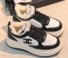 Женские кожаные кроссовки с мехом на платформе Chanel белые с черным 2026