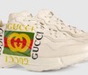 Кожаные кроссовки Gucci Rhyton белые с логотипом