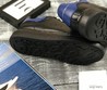 Мужские кожаные кроссовки Alexander McQueen черные с синей пяткой