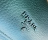 Кошелек кожаный Prada зеленый 19х10