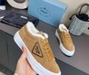 Женские зимние кроссовки Prada коричневые